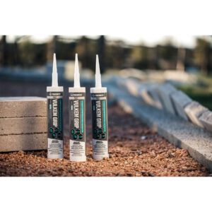 Vulkem Grip adhesive sealant tubes on a construction site for versatile bonding