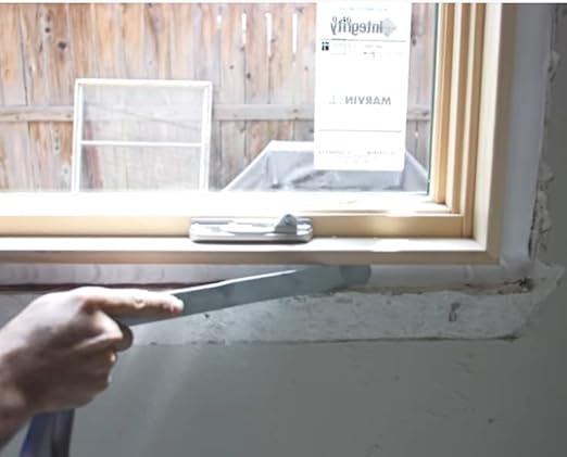 Installing backer rod and PROSOCO AirDam at window sill