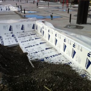 Below-grade EPS insulation installed on commercial foundation wall for thermal protection