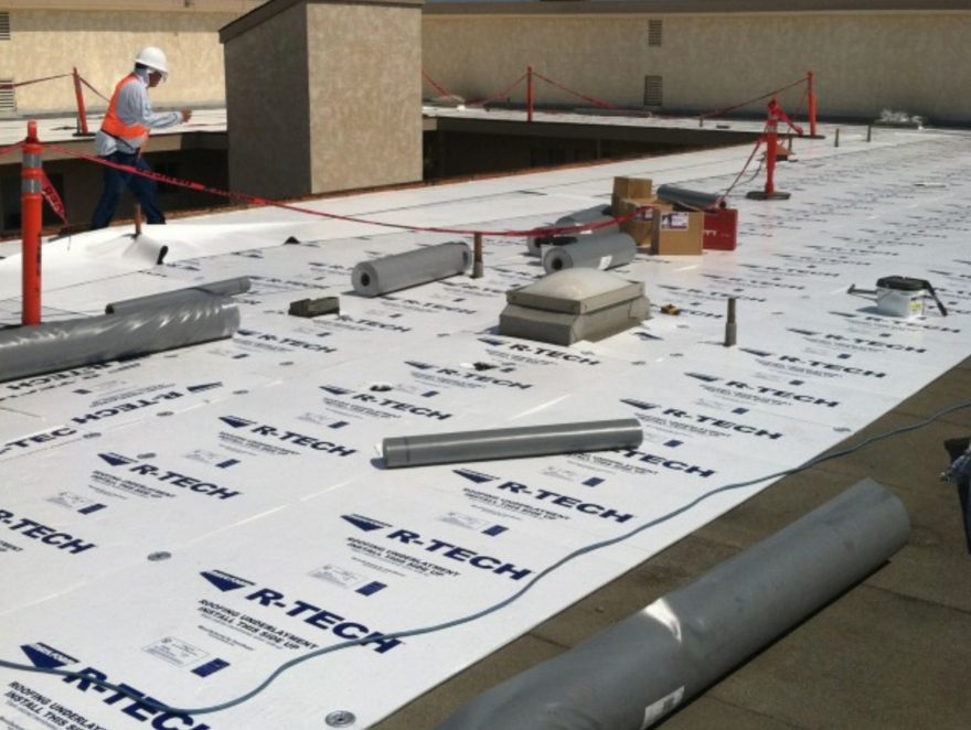 R-Tech EPS insulation boards prepared for installation on a commercial flat roofing system