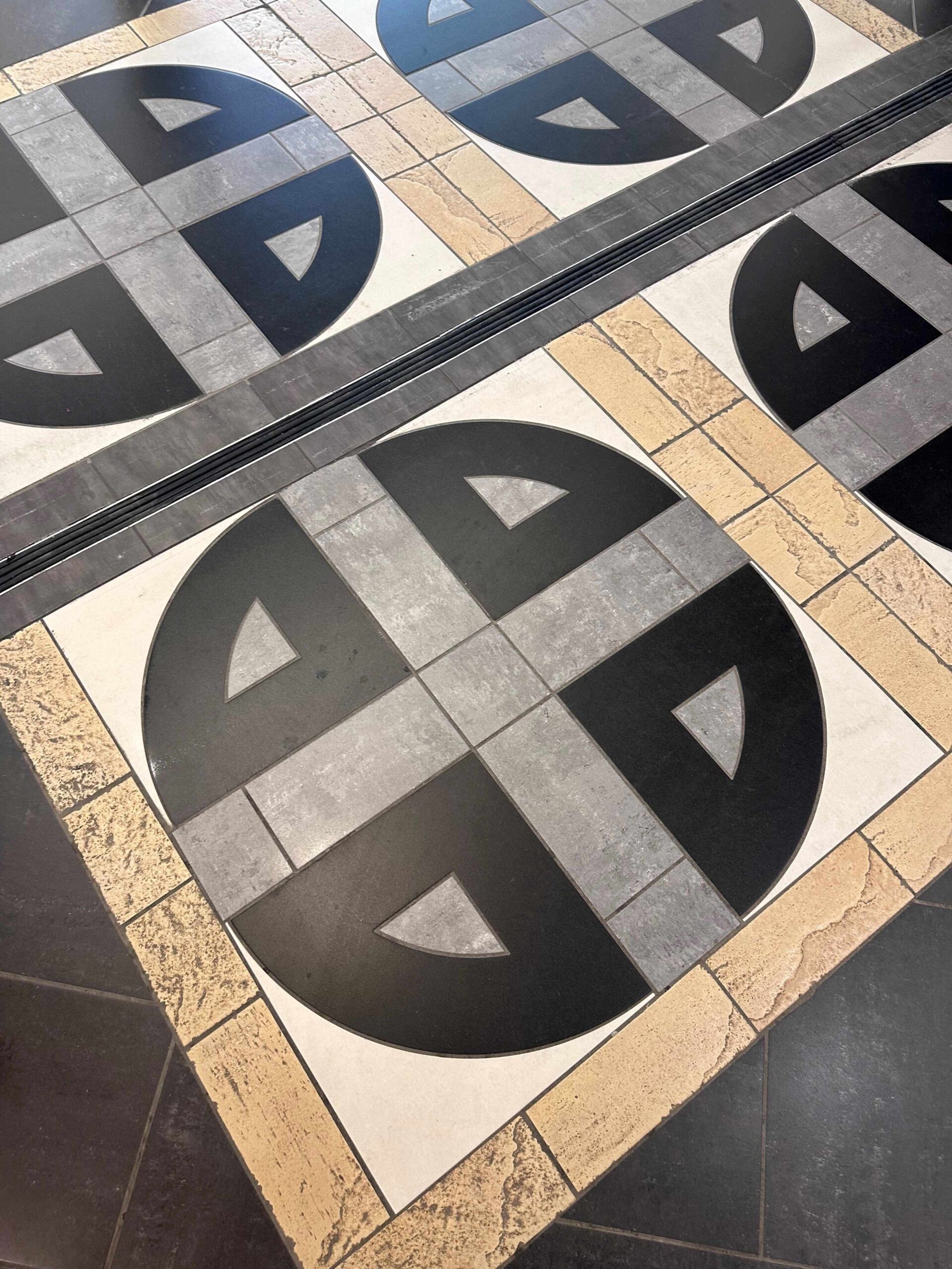 Willseal 250R expansion joint flush with patterned tile floor in indoor mall