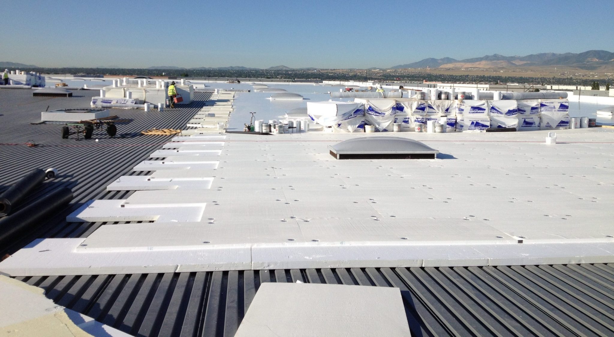 Commercial roof insulation installed with Insulfoam EPS panels on flat roofing system