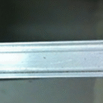 Close-up of Paraseal Paraterm Bar™ aluminum termination accessory with pre-drilled fastening holes