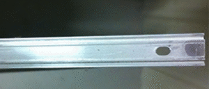 Close-up of Paraseal Paraterm Bar™ aluminum termination accessory with pre-drilled fastening holes