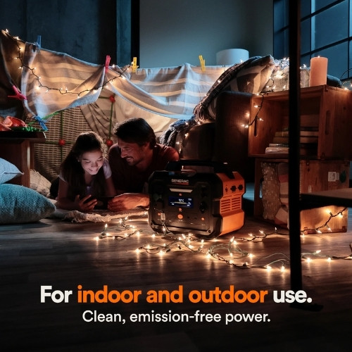 Generac portable power station used indoors with string lights for safe, emission-free energy.